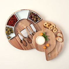 a wooden platter filled with different types of food