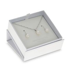 This lovely pearl pendant and drop earrings set proclaims her simple yet elegant style. Crafted in sterling silver, each piece features a luminous 6.0-7.0mm oval-shaped freshwater cultured pearl dangle. The pendant suspends along an 18.0-inch herringbone chain that secures with a spring-ring clasp. The coordinating earrings secure with French wire backs. Buffed to a brilliant luster and sure to be worn often, this two-piece ensemble is the perfect accompaniment to her anytime attire. This set ar White Gold Oval Pearl Drop Jewelry, Oval Pearl Drop Jewelry As Gift, Oval Pearl Drop Jewelry For Gifts, Modern Sterling Silver Pearl Necklace Gift, White Gold Oval Pearl Necklace Gift, Oval White Gold Pearl Necklace Gift, Elegant Oval Sterling Silver Jewelry Sets, Teardrop Pearl Drop Jewelry Sets For Gifts, Sterling Silver Jewelry Sets With Pearl Drop As Gift