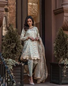 Cotton Silk Churidar With Dupatta And Long Sleeves, Semi-stitched Embroidered Lawn Suit, Eid Cambric Lawn Suit With Intricate Embroidery, Festive Cambric Lawn Suit With Intricate Embroidery, Straight Kurta Lawn Suit With Intricate Embroidery In Cambric, Intricate Embroidered Mulmul Unstitched Suit For Eid, Formal Cambric Sets With Dupatta, Diwali Unstitched Cambric Suit With Intricate Embroidery, Eid Sharara With Intricate Embroidery In Cambric