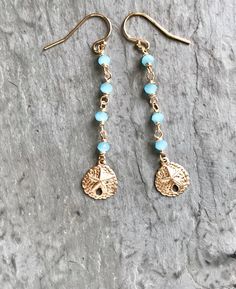 Dainty Gold Sand Dollar Earrings These cute beachy earrings feature detailed sand dollars which swing from a beaded chain of glowing, aqua-blue chalcedony. I personally wire-wrap the stones by hand, using 14k gold-filled wire, for a beautiful finish which won't tarnish or rub off like gold-plating. Lots of shimmery detail, perfect for summer days (and summer dreaming). Ideal for your beach holiday or wedding. Makes a lovely gift. GEMSTONES: Aqua-blue chalcedony - faceted rondelles, 3 mm LENGTH: Teardrop Beaded Jewelry For The Beach, Beach Dangle Beads Jewelry, Beaded Teardrop Jewelry For The Beach, Beach Jewelry With Teardrop Dangling Beads, Beaded Dangle Beach Jewelry, Teardrop Dangling Beads Jewelry For Beach, Beaded Dangle Jewelry For The Beach, Beaded Dangle Jewelry For Beach, Blue Dangle Beaded Earrings For Beach