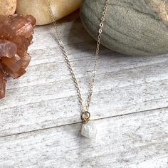 Beautiful and all-natural moonstone gemstones electoplated in 14k gold and hung from a dainty an light-catching gold fill chain. ✧ Hand-picked stones electroplated in 14k gold. ✧All natural stones ✧ High quality gold fill chain and clasp ✧ Lightweight and easy for everyday ✧ Ready for gifting in a hand-stamped boho gift box. ✧Super fast shipping. Usually same day or next day. About our gems* Each of the stones we use to create pieces were formed by nature over millions of years. Each one is uniq Gold Moonstone Jewelry With Delicate Chain, Delicate Moonstone Necklace With Delicate Chain, Delicate Moonstone Gold Jewelry, Dainty Gold Moonstone Jewelry, Delicate Gold Moonstone Jewelry, Gold Minimalist Moonstone Jewelry, Minimalist White Gemstone Birthstone Necklace, Minimalist White Birthstone Necklace, Gold Crystal Healing Necklaces 14k Gold Filled