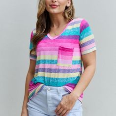 This Trendy And Versatile Top Is A Must-Have Addition To Your Wardrobe, Combining Comfort, Fashion, And Functionality In One Chic Package. This Top Ensures A Comfortable And Lightweight Feel, Making It Perfect For All-Day Wear. The Short Sleeves Provide A Relaxed And Casual Look, Ideal For Both Casual Outings And Semi-Formal Occasions. The Standout Feature Of This Top Is Its Eye-Catching Multi-Color Stripe Print. The Vibrant Combination Of Colors Adds A Pop Of Personality To Any Outfit, Instantl Pink Color Block V-neck Top, Pink V-neck Color Block Top, Comfort Fashion, Visually Pleasing, Born This Way, Striped Short, Color Stripes, Short Sleeve Top, Stripe Print