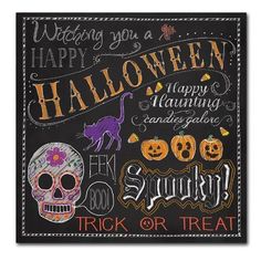 a chalkboard sign with halloween decorations and lettering on the front, says happy halloween