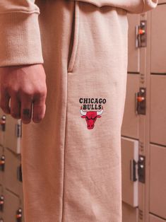 always feel like the home team with the french terry?new legacy?sweatsuit pants' cozy and premium feel. featuring vintage?chicago bulls accent on the sweatpants,?it's 20,000 cheering fans live game ready or peacefully lounging in the home worthy. *sweatsuit pants only |?find the matching?mock neck?for the sweatsuit?here. Collegiate Style Cotton Sweats For Loungewear, Cotton Sweatpants For Sports Season Loungewear, Cotton Sweatpants For Loungewear During Sports Season, Cotton Joggers For Loungewear During Sports Season, Cotton Athleisure Pants For Sports Events, Collegiate Relaxed Fit Sweats For Loungewear, Collegiate Cotton Bottoms For Streetwear, Casual Cotton Sweats For Sports Events, Casual Pants For Sports Season Events