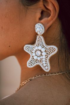 These Ivory Star Fish Seed Beaded Earrings are totally on fleek! Uniquely designed with a gorgeous star-shaped pattern, these earrings will have you feeling like a star wherever you go. Show off your style with this sparkle-infused accessory and make a statement! Approx 2.75" Drop Hypoallergenic post White Starfish Charm Star Earrings, White Star-shaped Earrings With Starfish Charm, White Star-shaped Earrings With Star Charm, Seed Beaded Earrings, Star Fish, Seed Bead Earrings, Star Shape, Starfish, Beaded Earrings