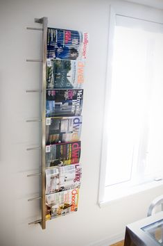 a magazine rack in the corner of a room