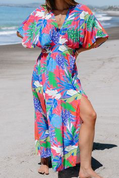 Embrace weekend vibes in the Bright Tropical Smocked Maxi Dress. Perfect for brunch with friends or a family gathering, its easy-going style and bright print make every day feel like a getaway. Product code: CAA05A4D165EE Features:  Knit V-neck Smocked waist Maxi Pattern: Tropical Material: 100%RAYON. Jungle Dress, Maxi Pattern, Pattern Dresses, Smocked Maxi Dress, Hawaii Outfits, Prom Dress Shoes, Affordable Swimwear, Swimsuits Bikinis