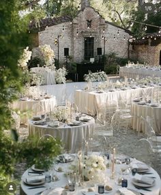 an outdoor wedding venue with tables and chairs