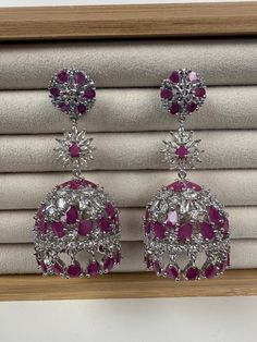 Height = 2 .5 inches Best gift option for your loved ones comes in an exquisite gift box. Highest quality and craftsmanship. Hallmarked Earrings As Diwali Gift, Festive Drop Bridal Earrings As Gift, Festive Bridal Earrings As Gift, Chandbali Earrings As Eid Gift, American Diamond Earrings As Gift, Silver Bollywood Danglers As A Gift, Fusion Style Round Danglers As Gift, Pink Danglers For Gift, Festive Hallmarked Danglers For Gift