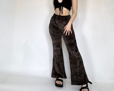 The Gianna Pants are designed with a velour fabric that provides both a luxurious feel and a comfortable fit. Featuring an elastic waistband and flared fit, these pants offer a retro silhouette. Model is 5'2 and wearing a S/M 70s Pants, Retro Silhouette, Velvet Flares, Velour Pants, Womens Trousers, Velour Fabric, Trousers Women, Favorite Outfit, Capri Pants