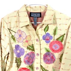 Step into spring with this vibrant Indigo Moon button-up jacket. The floral yellow design is beautifully embroidered and embellished, adding a touch of elegance to your wardrobe. Made with a cotton blend knit, this jacket is perfect for those cooler days. With its long sleeves and medium size, it's a must-have for any fashion-forward woman. Spring Multicolor Embroidered Top With Button Closure, Spring Embroidered Top With Button Closure, Yellow Spring Outerwear With Buttons, Yellow Buttoned Spring Outerwear, Multicolor Embroidered Top With Button Closure For Spring, Yellow Buttoned Outerwear For Spring, Spring Embroidered Collared Outerwear, Spring Multicolor Embroidered Tops With Buttons, Spring Embroidered Tops With Buttons