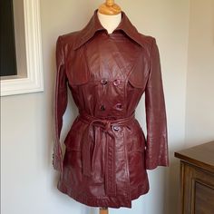 Rare Vintage Mint Condition! Etienne Agner Oxblood Red (Burgundy) Leather Coat Full Length, Double Breasted Versatile: Notched Collar Can Be Worn Buttoned Or Not (As Seen In Pics) The Lining Is In Perfect Condition Leather In Excellent Shape. No Flaws That I Can Find. All Original Buttons Size 12 : Comparable To Today’s Sizing Of A 4-6 Approx Measurements Flat Layed & Buttoned: Waist: 16.5” Across Bottom: 21” Shoulder Top Across: 16” Pit To Pit: 18.5” Sleeve Length: 22” This Jacket Is Fabulous! Fitted Single Breasted Burgundy Outerwear, Fitted Single-breasted Burgundy Outerwear, Fitted Vintage Burgundy Outerwear, Fitted Burgundy Vintage Outerwear, Fitted Vintage Red Outerwear, Chic Fitted Burgundy Outerwear, Vintage Burgundy Outerwear For Fall, Red Leather Blazer, Red Leather Coat