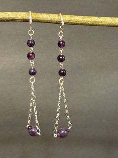 These are beaded handmade one of a kind Earrings / round purple Amethyst Gemstones / Sterling silver chain / Sterling silver lever backs / Sterling silver findings / Geometric triangular shape / Artisan designed and hand crafted Beaded Chain Dangle Chandelier Earrings For Gift, Sterling Silver Jewelry With Beaded Chain And Dangle Shape, Sterling Silver Dangle Earrings With Wire Wrapped Beads, Silver Dangle Earrings With Natural Stones, Beaded Silver-plated Wire Dangle Jewelry, Beaded Dangle Earrings With Silver Plated Wire, Beaded Silver-plated Dangle Jewelry, Sterling Silver Wire Wrapped Dangle Beaded Earrings, Sterling Silver Beaded Long Drop Jewelry