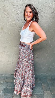 From the beach to brunch to any other summer day, give your wardrobe a boho twist with the Valerie Boho Skirt. Featuring a multi-colored paisley print with a gray background, pops of yellow, red, pink, and blue that come together in an eye-catching pattern. The pretty border detail around the edges offers a nice finished look. The hi-low cut of this bohemian maxi skirt is perfect for vacationing or every-day wear, all while offering a flattering waistband and a flowy fit that will have you feeli Multicolor Boho Print Beach Bottoms, Bohemian Floral Print Bottoms For Beach Season, Bohemian Beach Season Floral Bottoms, Summer Bohemian Floral Print Skirt, Spring Hippie Wrap Skirt, Multicolor Boho Print Summer Bottoms, Bohemian Floral Print Skirt For Summer, Bohemian Floral Print Summer Skirt, Hippie Floral Print Maxi Skirt For Vacation