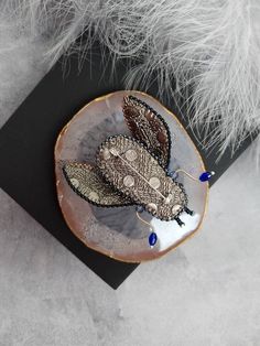 "Beautiful dark purple beetle brooch (cicada brooch) is lovely handmade by me. 💓 This beautiful hand embroidered beetle brooch (cicada brooch) took hours of precision and elaborate embroidery work. This cicada brooch will be a wonderful gift to a very special person! SIZE Size: 5,5 cm (2,16\") (without legs) MATERIALS Made of czech, japanese seed beads, glass crystals and sequins. Beaded jewelry requires careful and loving care. Avoid contact with hairspray, perfume, water, bleaches & lotio Handmade Artisan Brooches For Gift, Artisan Handmade Brooches For Jewelry Making, Unique Embroidered Brooch For Gift, Unique Embroidered Brooches For Gifts, Bohemian Handmade Pins As Gift, Handmade Unique Brooches For Crafting, Silver Embellished Brooches For Gift, Unique Handmade Wedding Pins, Embroidered Beetle