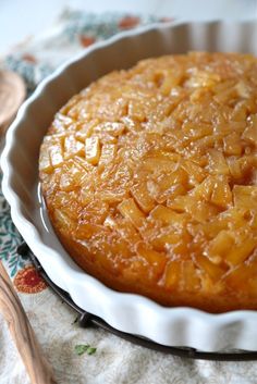 a close up of a cake in a pan on a table