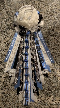 a bunch of ribbons that are on top of a granite countertop, with the words toronto written in blue and white