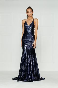 The Gigi Gown is a stunning mermaid fit dress with a v-neck and lace up back. The sequinned material is stretchy and it is lined to the hem. There is a hidden zipper on the back. What is a Made-To-Order? This product is a made-to-order item. Made-to-order items are not held in physical stock and production commences AFTER order placement. We try to limit production and stock levels and as such, made-to-order items produce less waste and allow you to purchase your dream gown without the chance of Glamorous V-neck Fitted Mermaid Dress, V-neck Mermaid Dress With Sequins For Night Out, Sequined V-neck Mermaid Dress For Night Out, V-neck Mermaid Dress With Sequins For Gala, Sequined Mermaid Dress With Fitted Bodice, Mermaid Dress With Sequined Fitted Bodice, Fitted V-neck Sequin Mermaid Dress, Sequined Mermaid Hem Gown For Night Out, Fitted Mermaid Sequin Dress For Gala