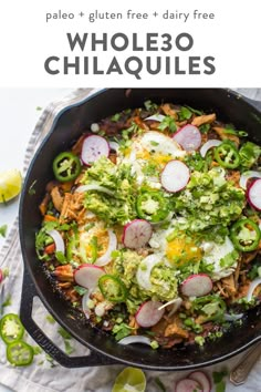 a skillet filled with salad and topped with sliced radishes, onions, green peppers