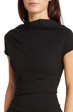 Rippled ruching shapes this sleek, sophisticated dress designed with a drapey cowl neck and slight sleeves. Cowl neck Cap sleeves Lined 95% rayon, 5% spandex Dry clean Made in the USA Elegant Bodycon Top With Short Sleeves, Black Fitted Top With Cowl Back, Elegant Bodycon Short Sleeve Tops, Fitted Black Cowl Neck Dress, Black Fitted Cowl Neck Dress, Sleek Fitted Cowl Neck Dress, Elegant Fitted Top With Cowl Back, Elegant Fitted Tops With Cowl Back, Fitted Cowl Neck Tops For Formal Occasions