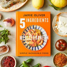 the book 5 ingredients by jamie olliver is surrounded by other food and vegetables