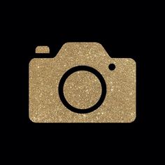 a camera with a black background and gold glitter on the lens, which is part of an instagram icon