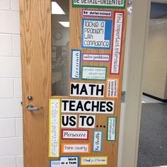 a bulletin board with words on it in front of a door that says math teaches us to