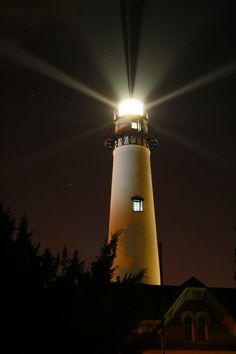 the light house is lit up at night