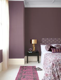 a bedroom with blue walls and purple carpet