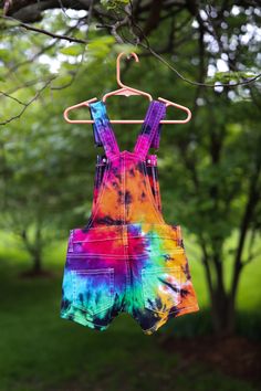 | Tie Dye Girl's Overall Shorts | ❤️ These vibrant little overalls are perfect for sunshiney spring and summer days! The material is incredibly soft, stretchy and durable for all the activities your little hippie will be doing. These overalls come in several different fabulous colors, but can also be ordered in custom colors, if you would like to design your own. Please check out our adult overall shorts in the link below to order a matching mommy & me set: https://www.etsy.com/listing/69416 Multicolor Bottoms For Playtime In Summer, Multicolor Bottoms For Summer Playtime, Multicolor Summer Bottoms For Playtime, Multicolor Summer Bottoms For Playwear, Summer Playwear Bottoms In Multicolor, Summer Multicolor Bottoms For Playwear, Multicolor Summer Playwear Bottoms, Multicolor Jumpsuits And Rompers For Spring Playtime, Fun Multicolor Bottoms For Playwear