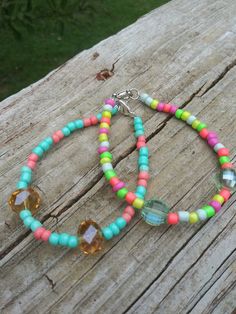 These bracelets feature bright colorful beads perfect for summer Trendy Beaded Bracelets For Summer Festivals, Trendy Summer Festival Beaded Bracelets, Turquoise Beaded Friendship Bracelets For Summer, Trendy Beaded Bracelets For Beach Season, Casual Summer Jewelry With Colorful Beads, Turquoise Friendship Bracelets With Colorful Beads For Summer, Colorful Beaded Bracelets For Beach Season, Colorful Beads Bracelet For Beach Season, Multicolor Beaded Bracelets For Spring Vacation