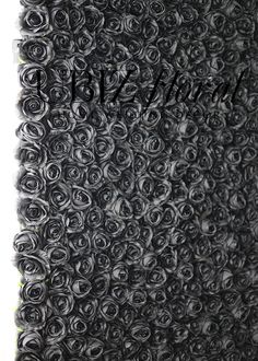 the black rosette wall is made up of many small roses