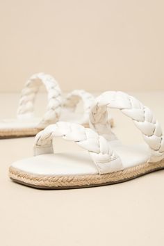 Step into summer with a fresh new look thanks to the Lulus Kennmar Off White Leather Braided Espadrille Slide Sandals! These smooth genuine leather sandals have a comfortable slide-on design, two braided straps, and a square toe bed. Sole is trimmed in beachy jute for a Boho-inspired finish. 0. 5" Rubber heel. Cushioned insole. Rubber sole has nonskid markings. Genuine leather upper. Balance man made materials. Imported. Lulus | Kennmar Off White Leather Braided Espadrille Slide Sandal Heels | S Woven Leather Sandals For Summer, Leather Sandals For Summer Vacation, Adjustable Woven Leather Sandals For Summer, Leather Slides For Beach In Summer, Leather Slides For Summer Beach, White Leather Sandals For Summer, Leather Slides For Summer Beach Outings, Summer Sandals With Woven Leather For Spring, Spring Summer Sandals With Woven Leather