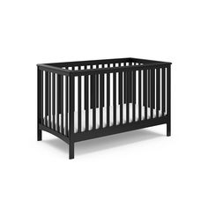 a black crib with white sheets on the bottom and sides, in front of a white background