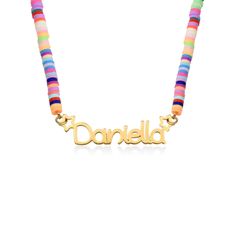 Put a smile on her face with our Rainbow Magic Girls Name Necklace in Gold Plating. This adorable piece brings colorful beads together with a nameplate that showcases her name or nickname in a fantastic print font, complete with a whimsical star accent. This necklace is made with gold plated Silver. Features include:Colorful fimo beadsPersonalized name plateOne name or inscriptionPretty star accentWhy She's Going To Love It:It's the perfect combination of bright rainbow colors and gorgeous gold! Soft Necklace, Polymer Clay Beaded Necklace, Fimo Beads, Clay Bead Necklace, Rainbow Pearl, Rainbow Magic, Choker Pendant, Elastic Rope, Bright Rainbow