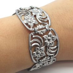 Great vintage condition.  925 Sterling Silver Vintage W. E. Richards Floral Panel Link Bracelet 7.75"  Weight: 37.6g   WELCOME TO PAWN SHOP We are an actual pawn shop and have been in business for over 25 years. Since 1990, our establishment has been serving a variety of clients by providing them with short term cash solutions and options of liquidity regarding their treasured heirlooms. Acknowledging that today′s customers are very sophisticated and are looking for a variety of investments, our Vintage Sterling Silver Bracelet With Intricate Design For Anniversary, Vintage Sterling Silver Bracelet In White Gold, Vintage Sterling Silver Wedding Bracelet, Vintage White Gold Bracelets, Vintage Sterling Silver Bracelet Stamped 925 For Formal Occasions, Vintage White Gold Bracelets Stamped 925, Vintage Stamped 925 Sterling Silver Bracelet, Vintage Silver Bracelet With Oxidized Finish, Vintage Adjustable Sterling Silver Bracelet With Oxidized Finish