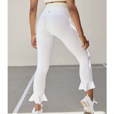 Free People Fp Movement Super High Rise Sanctuary Leggings $128 Nwt White Xsmall. Condition Is New With Tags. Shipped With Usps First Class. Some High Risen Leggings With A Cropped Leg Is Finished Off With Graceful Flowy Ruffles For A Feminine Style. Fit:- Elasticized Waist - Ruffle Trim - Cropped Leg - Approx. 11.25" Rise, 24.25" Inseam (Size S) - Made In Usa Fiber Content 50% Polyester, 37% Cotton, 13% Rayon Care Machine Wash Cold With Like Colors,Tumble Dry Low, Low Iron,Do Not Dry Clean Compressive White Leggings For Workout, White Compressive Leggings, White Moisture-wicking Leggings For Jogging, White Sporty 4-way Stretch Leggings, White Moisture-wicking Leggings For Yoga, Ruffle Leggings, Free People Pants, Fp Movement, Ruffle Trim