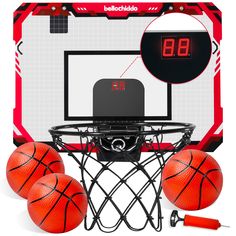 an electronic basketball game with three balls in front of it and the scoreboard behind it