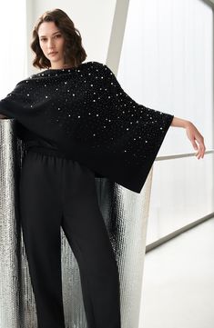 Add an elegant layer with a drapey poncho knit from wool and cashmere and dappled in glossy imitation pearls. 20" width; 30" length 65% wool, 35% cashmere Dry clean Imported Elegant One-size Cashmere Poncho, Elegant Evening Poncho For Fall, Elegant Fall Poncho Cape, Elegant Winter Capelet, Elegant Evening Cape For Winter, Winter Evening Capelet, Elegant Evening Winter Capelet, Elegant Evening Capelet For Winter, Elegant One-size Shawl Poncho