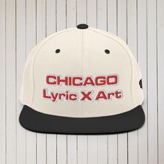 This Chi "Chicago" Lyric X Art hat is structured with a classic fit, flat brim, and full buckram. The adjustable snap closure makes it a comfortable, one-size-fits-most hat. Embroidered Design - Red, White, & Black colors in the design - Left side - 1981 • 80% acrylic, 20% wool • Green Camo is 60% cotton, 40% polyester • Structured, 6-panel, high-profile ��• 6 embroidered eyelets • Plastic snap closure • Green undervisor • Head circumference: 21⅝″–23⅝″ (54.9 cm–60 cm) Size guide A (inches) B (inch Chicago Lyrics, Green Camo, Heather Black, Embroidered Design, Snapback Hats, Childrens Clothes, Camo, Chicago, Product Launch