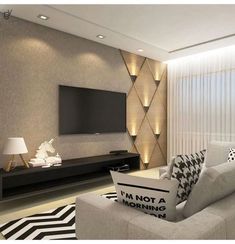 a modern living room with black and white decor on the walls, couches and television