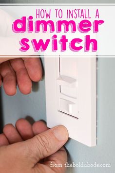 a person turning on a light switch with the text how to install a dimmer switch