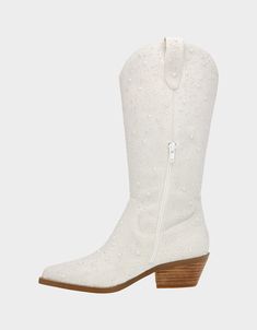 a pair of white cowboy boots with zippers and studding on the side,