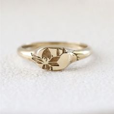 Solid Gold Signet Ring With Floral Lily Engraving. Ideal As Fashion Ring But Can Also Be Stacked As A Wedding Band. This Listing Is For The Single Ring. 14k Gold Width: Widest Part 6mm And .25 Inch Classic Round Flower Ring In 14k Gold, Classic 14k Gold Round Flower Ring, Elegant Stackable Signet Ring For Wedding, Wedding 14k Gold Signet Ring With Round Cut, Tarnish Resistant Recycled Gold Stackable Wedding Rings, Heirloom 14k Gold Flower Ring, Heirloom Style 14k Gold Flower Ring, Dainty 14k Gold Wedding Signet Ring, Dainty Wedding Signet Ring With Polished Finish