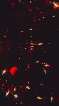 blurry image of red and blue lights in the dark