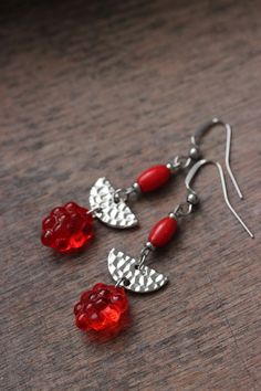 Lovely unique summer earrings with red czech glass berry beads, narural red coral stone beads, silver tone hammered semicircle charms connectors and stainless steel earring hooks. Earring hooks are from nickel free and lead free metal. Unique jewelry for you and a great gift for someone special! *The total lenght of earrings is about 58 mm including earring hooks. Other earrings of my shop you can see here: https://www.etsy.com/shop/NaTavelli?section_id=13757927 Thanks for visit. Handmade Red Czech Glass Beaded Earrings, Red Czech Glass Earrings With Dangling Beads, Nickel-free Red Beaded Round Earrings, Nickel-free Red Czech Glass Jewelry, Red Metal Earrings For Summer, Red Summer Jewelry With Dangling Beads, Red Jewelry With Dangling Beads For Summer, Summer Red Jewelry With Dangling Beads, Red Coral Earrings