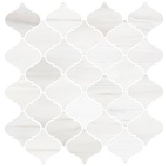 a white tile with an intricate design