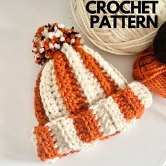 an orange and white knitted hat next to two balls of yarn with the words crochet pattern on it