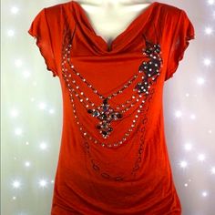 5/$25 Purchase This Item For Price Listed Or Bundle Any 5 Items Marked With A In Title For Only $25. No Shipping Discounts Given On 5 For $25 Items. Super Cute Boutique Too. Rust Red Colored Top, Blinged Out With Necklace Pattern On Front. Cowl Neck, Short Sleeved, Perfect With A Pair Of Leggings Worn Long Or Up On Waist With A Pair Of Jeans. Size Small 4/6 See Pics For More Details. Other Brands In My Closet: Avon, Ann Taylor, B. Darlin, Beanie Babies, Benedetta, Betsey Johnson, Better Homes And Gardens, Bebe, Bergere, Blue Cat, Blue Rain, Bobblebar, Brighton, Bronson Collectibles, Cartoon Network, Chaps, Chicos, Cloisonn, Coach, Converse, Cookie Lee, Crayola, Curr Casual Rhinestone Tops For Night Out, Trendy Rhinestone Tops For Fall, Daisy Fuentes, Blue Rain, Necklace Patterns, Blue Cat, Cute Boutiques, Beanie Babies, Blue Cats