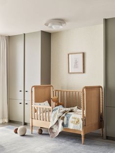 a baby's crib in the corner of a room